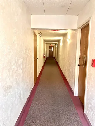 a kitchen with a refrigerator and a sink