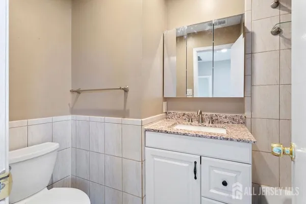 a bathroom with a sink and mirror