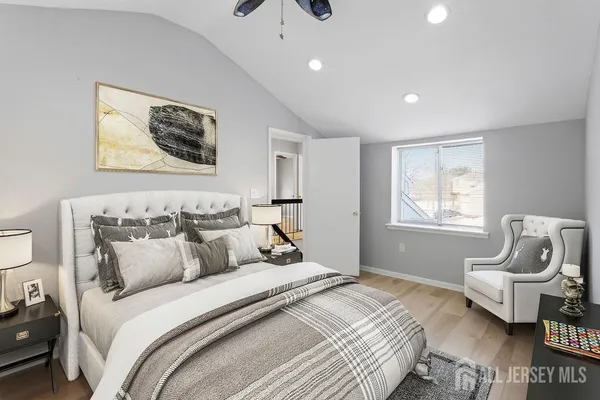 a bedroom with bed and furniture