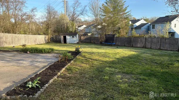 a swimming pool with wooden fence