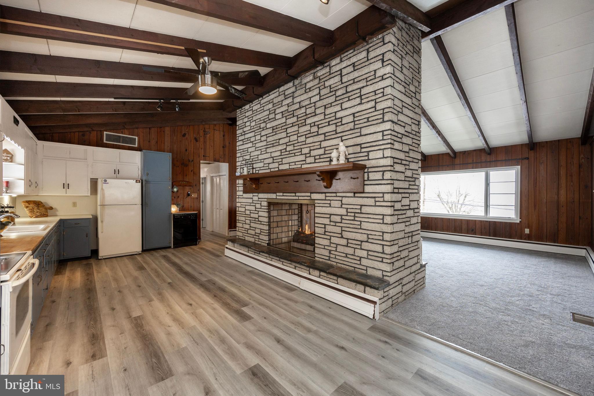 1358 Sheep Hill Road Pottstown, PA 19465 - Photo 6 of 27 Kitchen/Family Room double sided fireplace