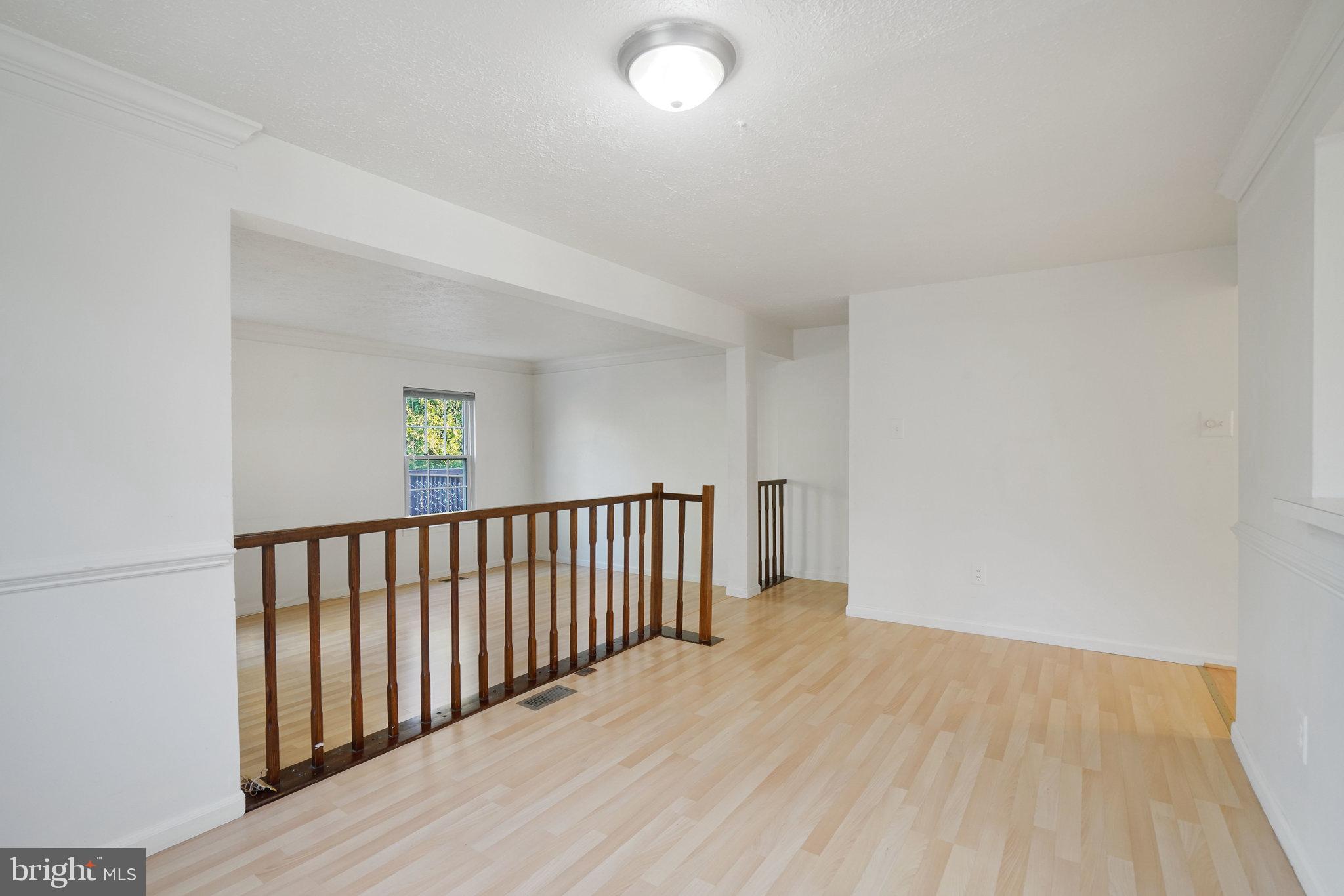 6515 Field Master Drive Springfield, VA 22152 - Photo 11 of 47 a view of a room with wooden floor