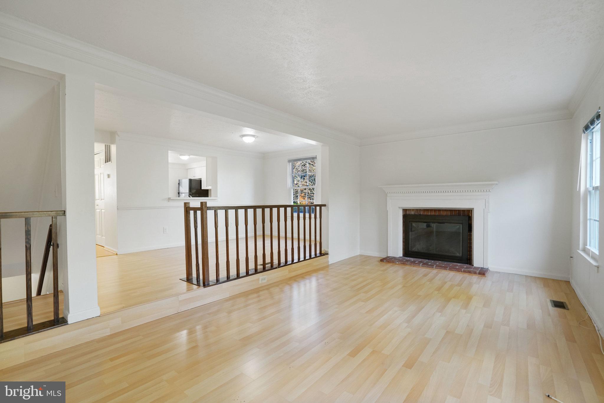 6515 Field Master Drive Springfield, VA 22152 - Photo 14 of 47 a view of an empty room with wooden floor and a window
