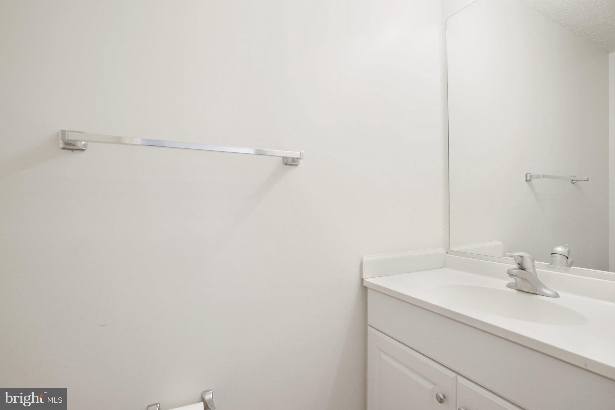 6515 Field Master Drive Springfield, VA 22152 - Photo 18 of 47 a bathroom with a sink and a mirror