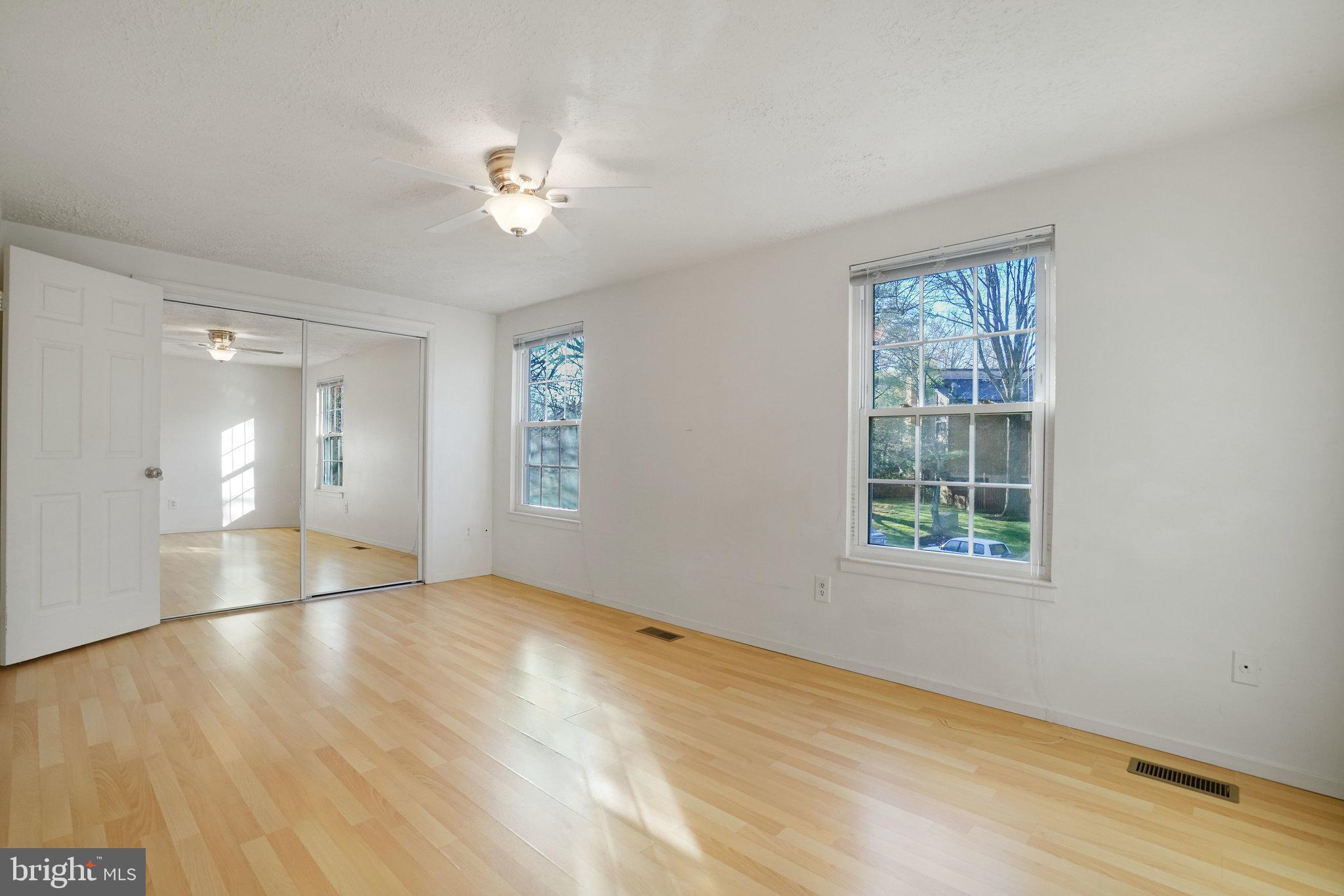 6515 Field Master Drive Springfield, VA 22152 - Photo 27 of 47 wooden floor in an empty room with a window