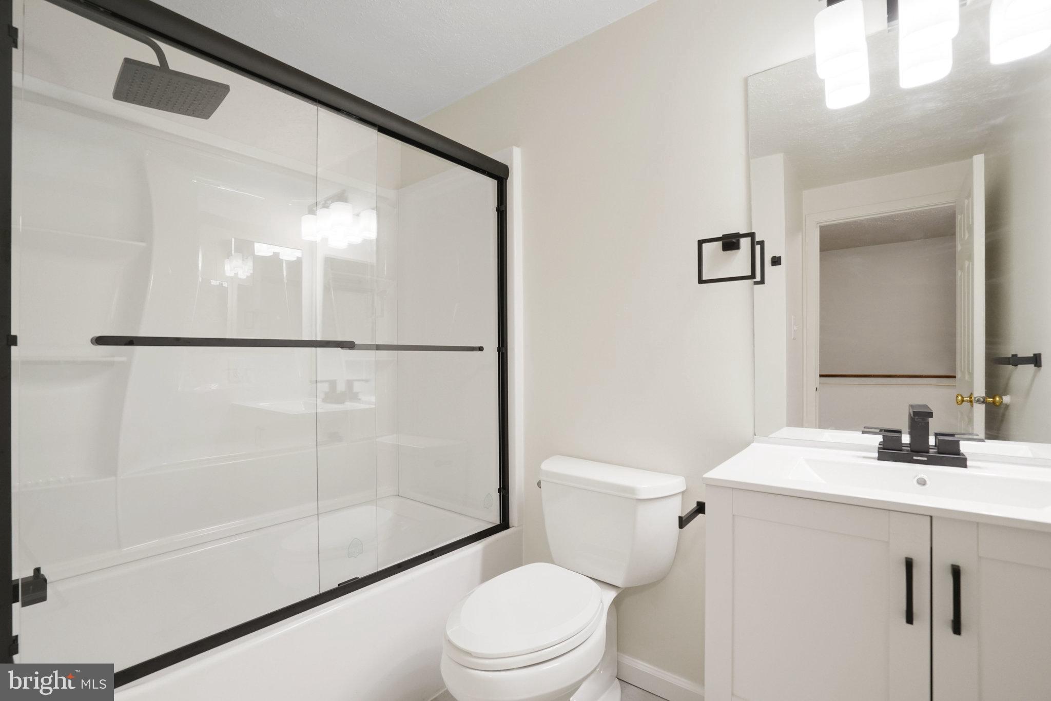 6515 Field Master Drive Springfield, VA 22152 - Photo 36 of 47 a bathroom with a sink mirror vanity and toilet