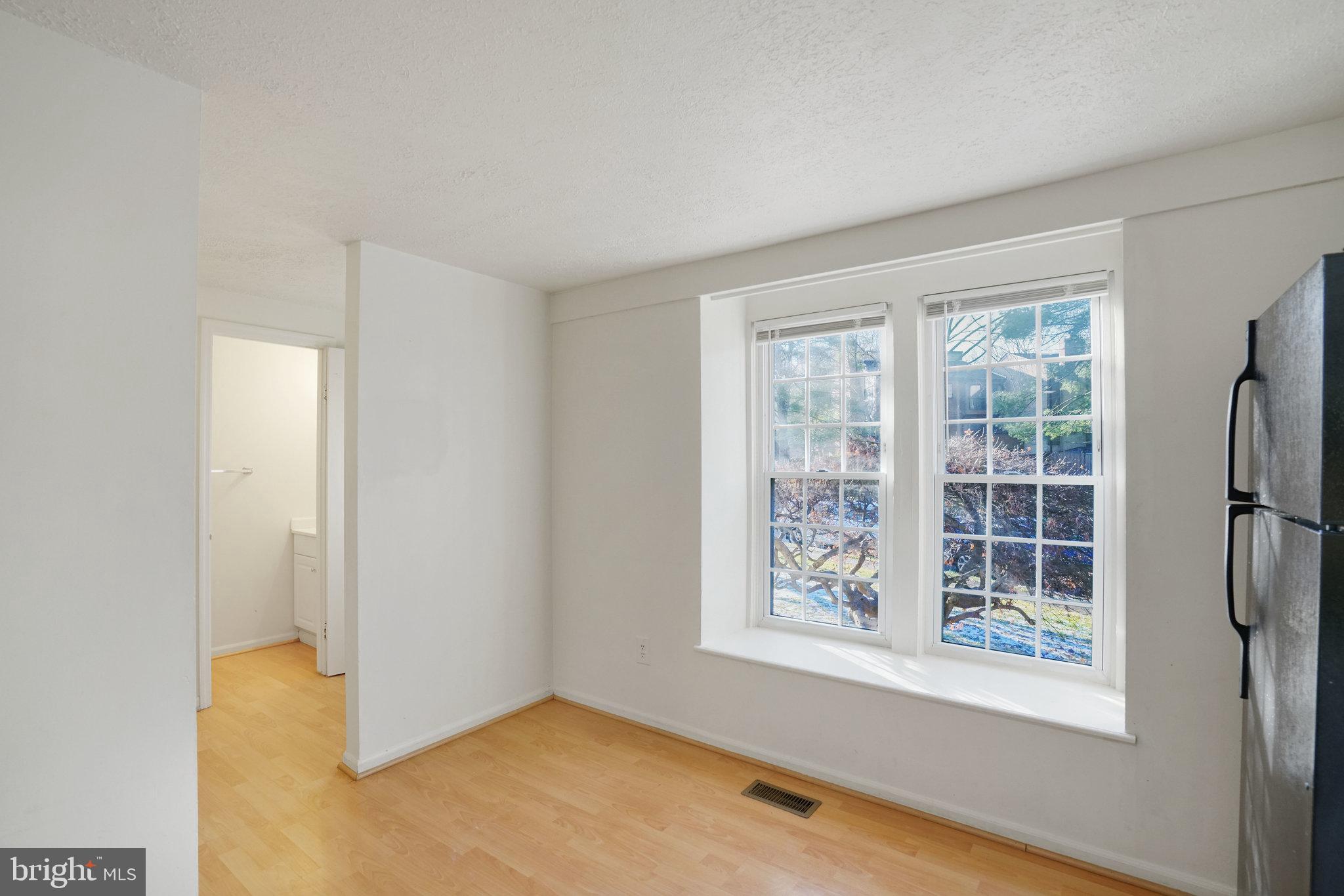 6515 Field Master Drive Springfield, VA 22152 - Photo 5 of 47 a view of a big room with windows and chandelier fan