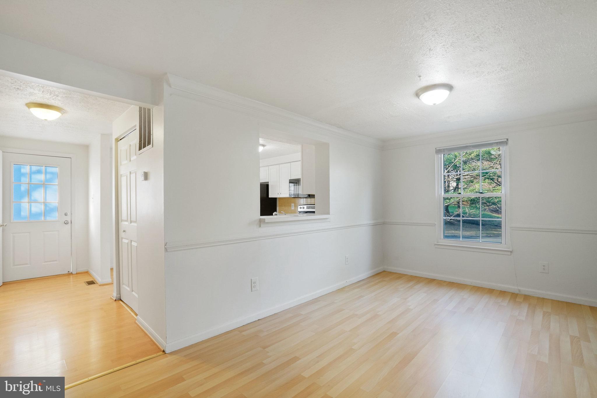 6515 Field Master Drive Springfield, VA 22152 - Photo 9 of 47 wooden floor in an empty room with a window