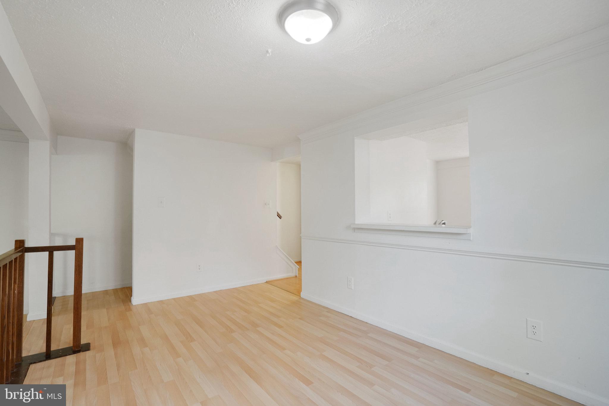 6515 Field Master Drive Springfield, VA 22152 - Photo 10 of 47 a view of empty room with wooden floor