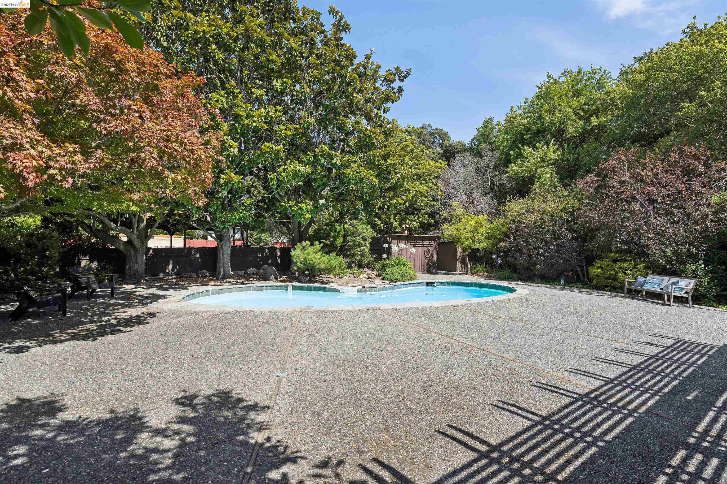 7 Jo Lin Court El Sobrante, CA 94803 - Photo 93 of 99 Freeform swimming pool surrounded by a large aggregate patio