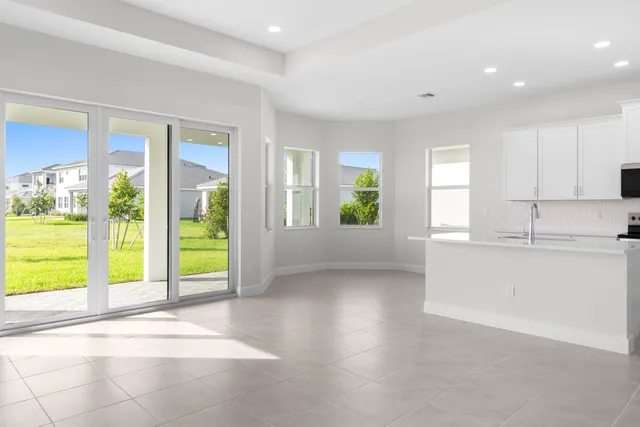 a view of a kitchen with a sink and a fireplace