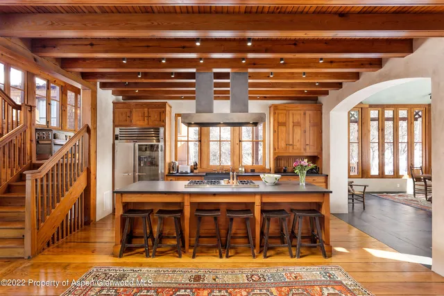 a view of kitchen with cabinets and wooden floor