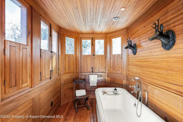 a living room with a large window and a table