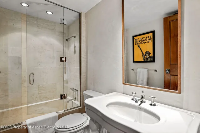 a bathroom with a sink vanity and a mirror