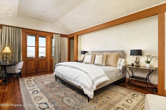 a bathroom with a tub and a large window