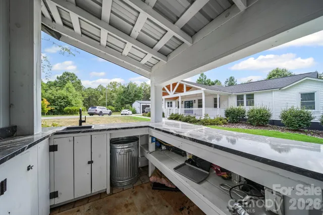 a kitchen with a sink and stove