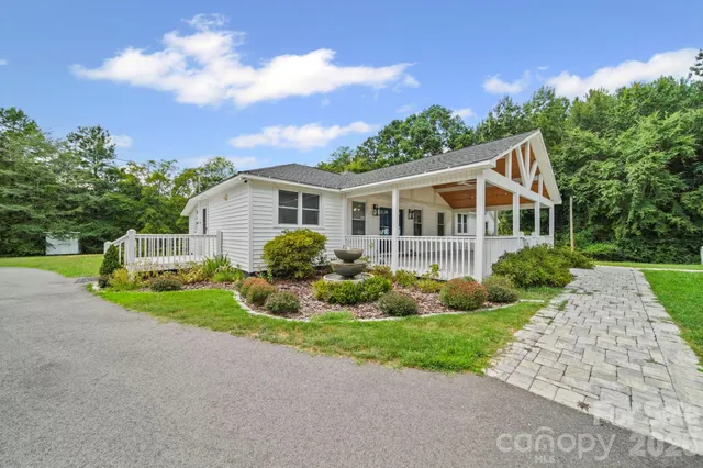a front view of house with yard and green space