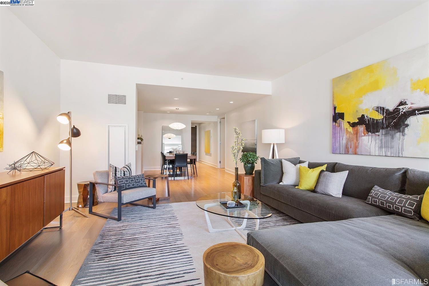 188 Minna, Unit 24F San Francisco, CA 94105 - Photo 4 of 11 a living room with furniture and wooden floor