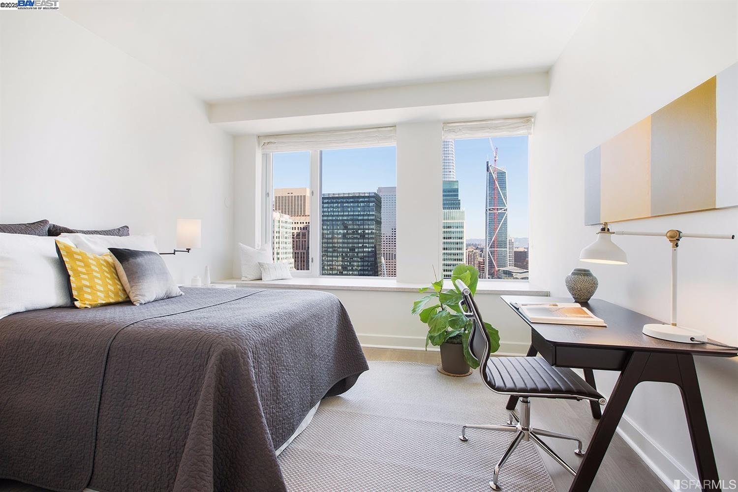 188 Minna, Unit 24F San Francisco, CA 94105 - Photo 7 of 11 a bedroom with a bed and a table