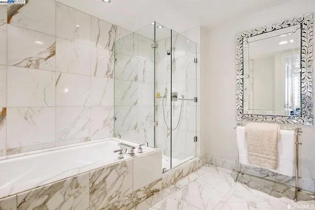 a bathroom with a bathtub and a shower