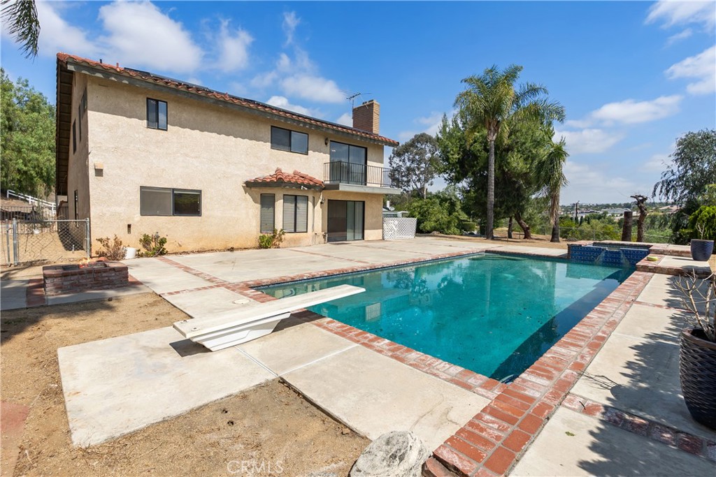 17656 Mockingbird Hill Circle Riverside, CA 92504 - Photo 29 of 49 a view of a house with a backyard