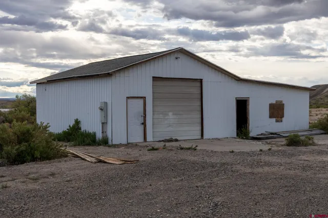 a backyard of a house with garage
