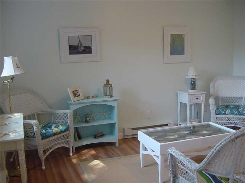 24 Barter Point Road Tenants Harbor, ME 04860 - Photo 5 of 14 Living Room. The cottage sports an...