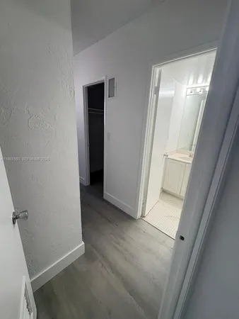 a view of closet area with empty racks