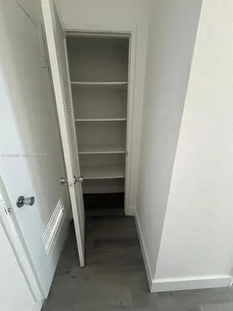 a view of an empty walk in closet