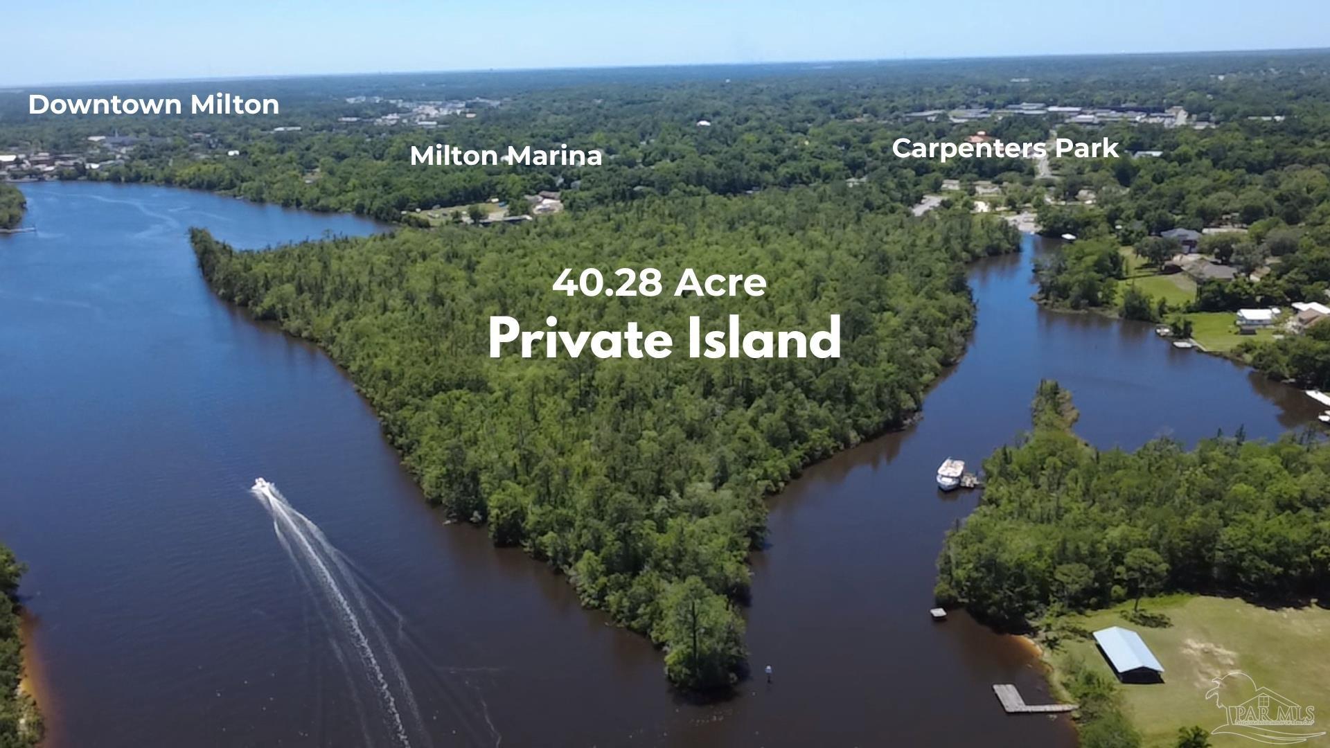 0 Broad Street Milton, FL 32570 - Photo 1 of 28 an aerial view of a golf course with parking space