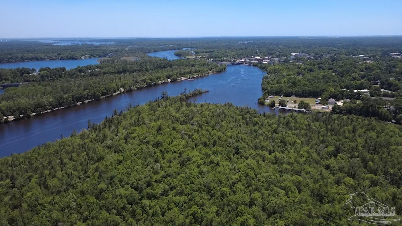0 Broad Street Milton, FL 32570 - Photo 11 of 28 an aerial view of residential houses with outdoor space and trees