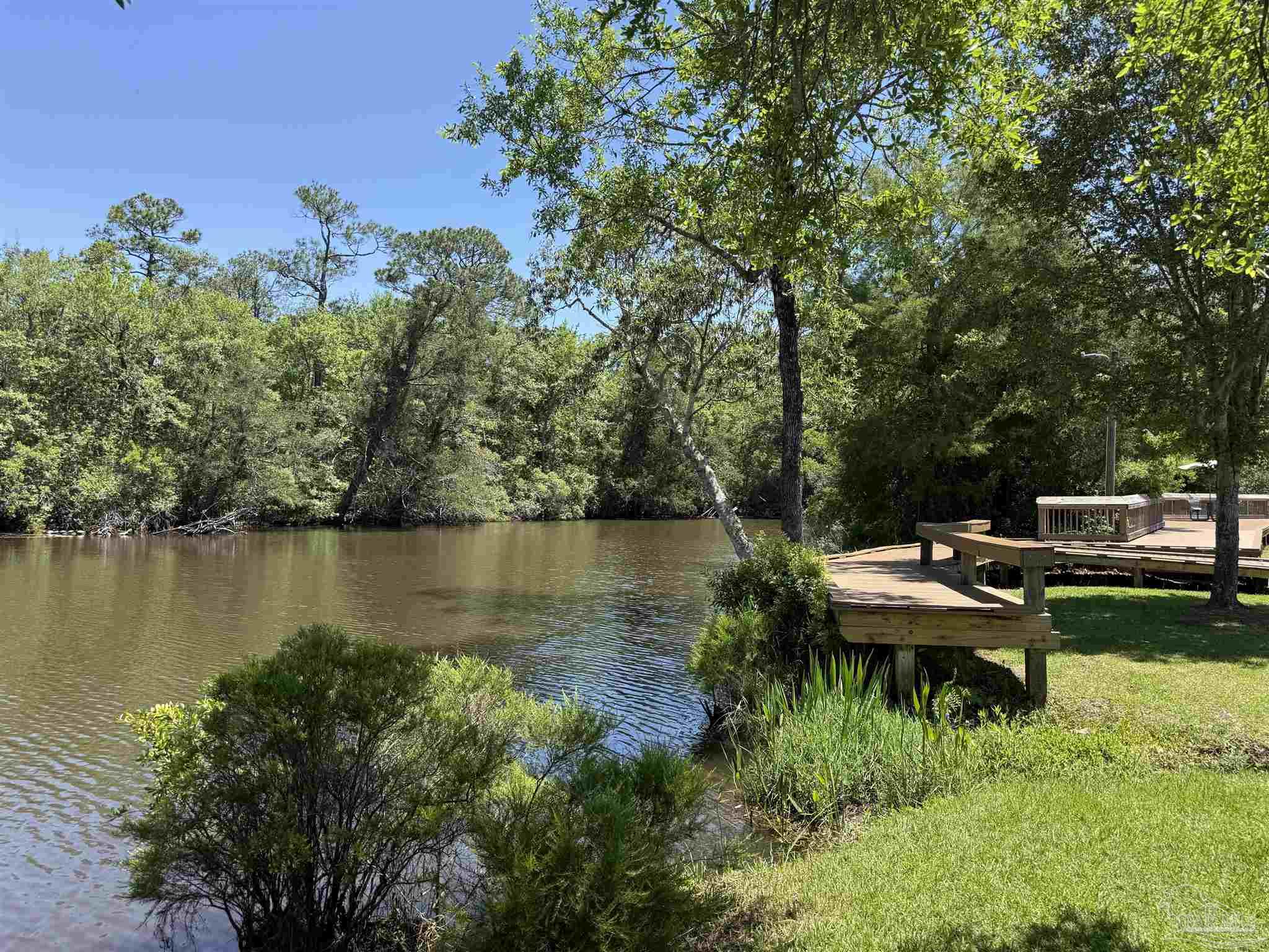 0 Broad Street Milton, FL 32570 - Photo 12 of 28 a view of a lake with sitting area