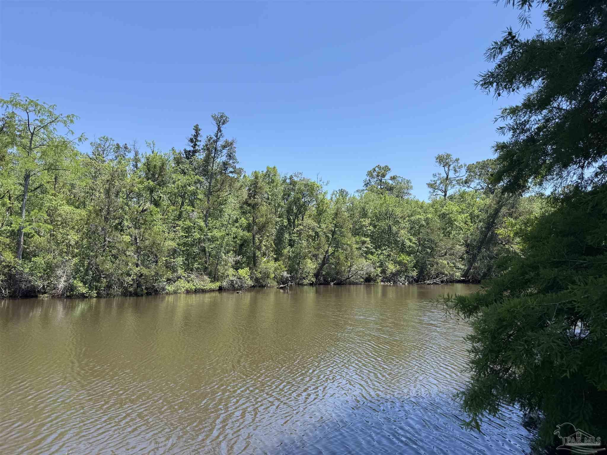 0 Broad Street Milton, FL 32570 - Photo 14 of 28 a view of a lake with a city view