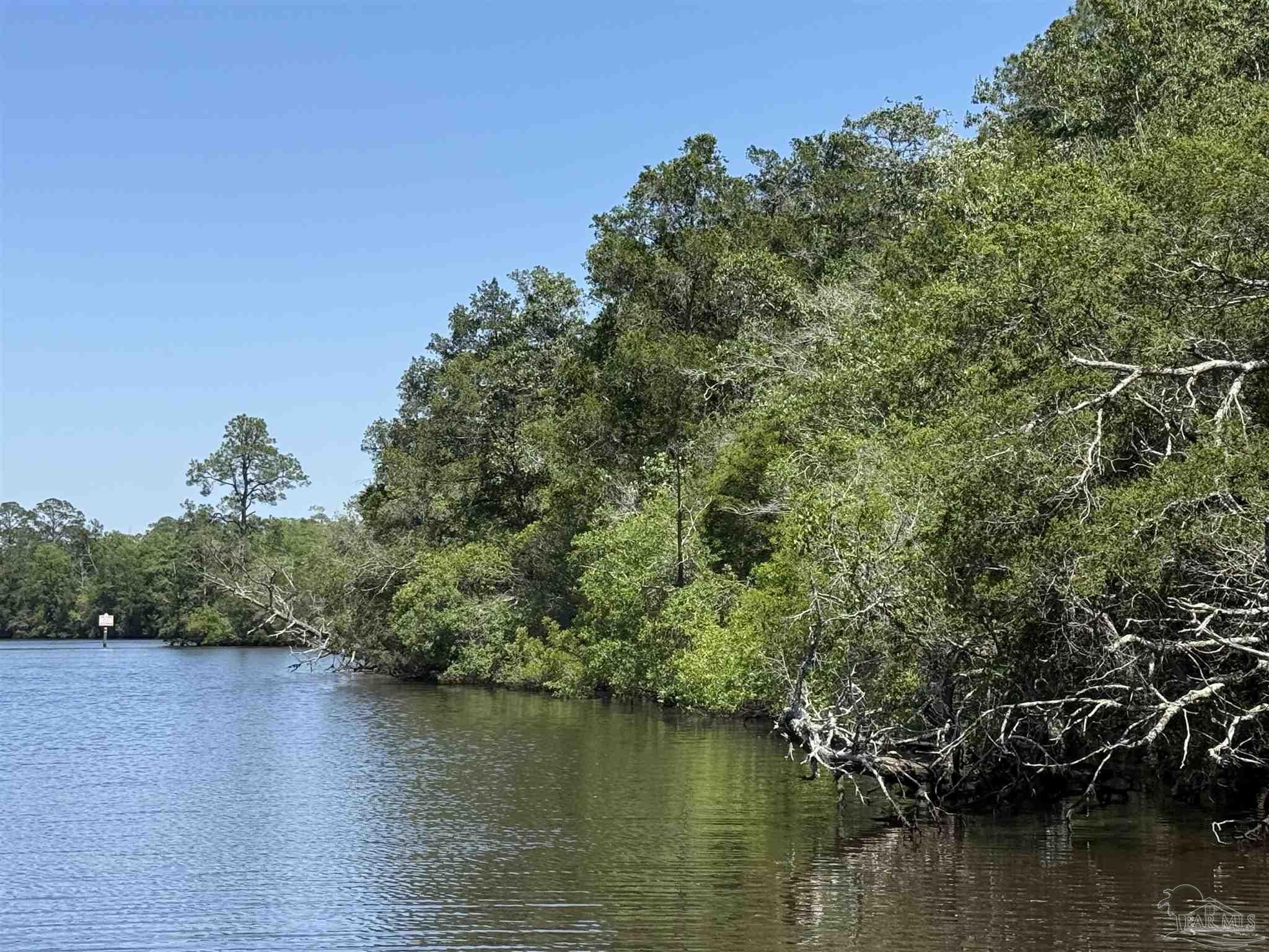 0 Broad Street Milton, FL 32570 - Photo 16 of 28 a view of a lake with houses