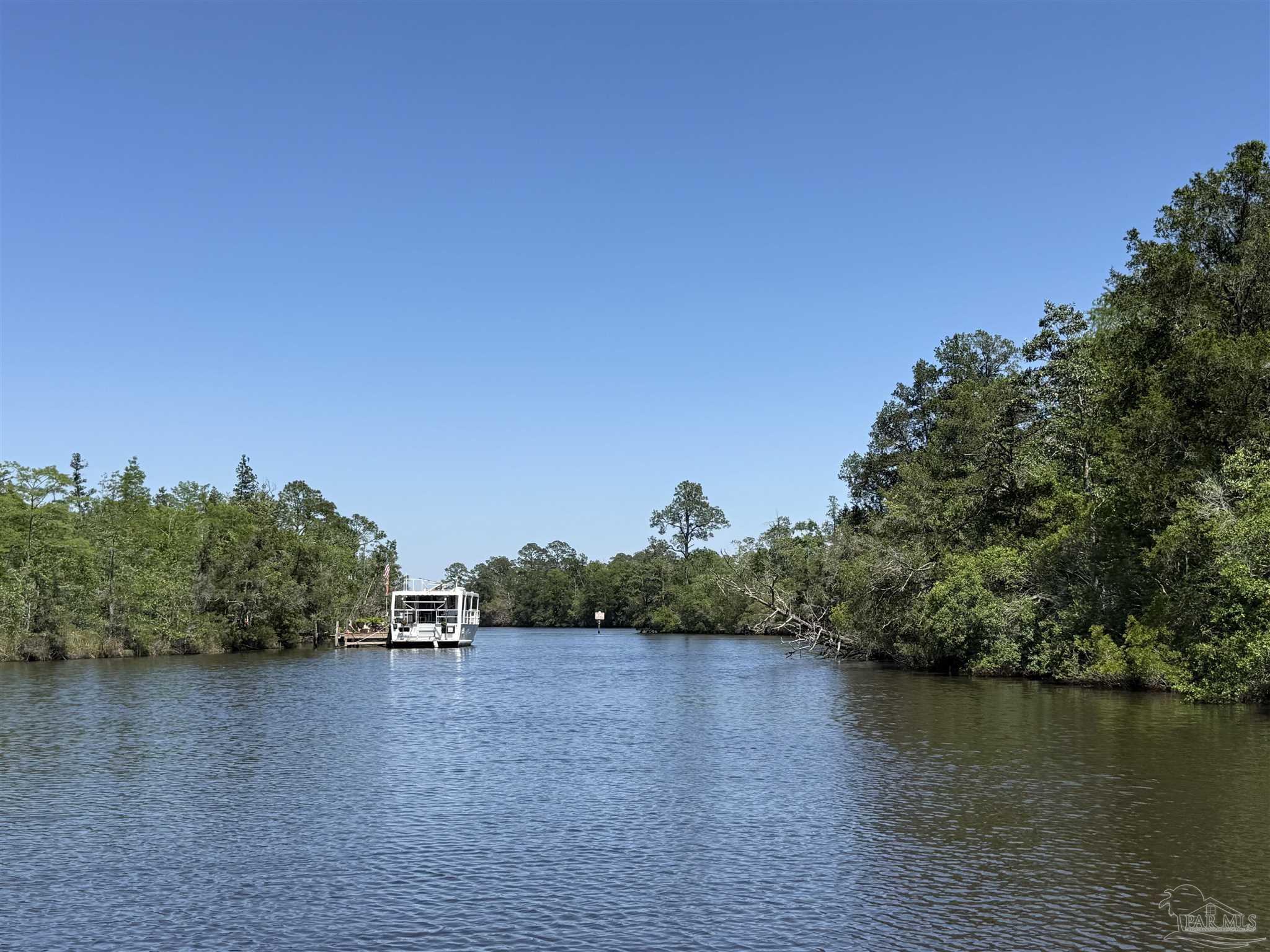 0 Broad Street Milton, FL 32570 - Photo 17 of 28 a view of a lake with houses