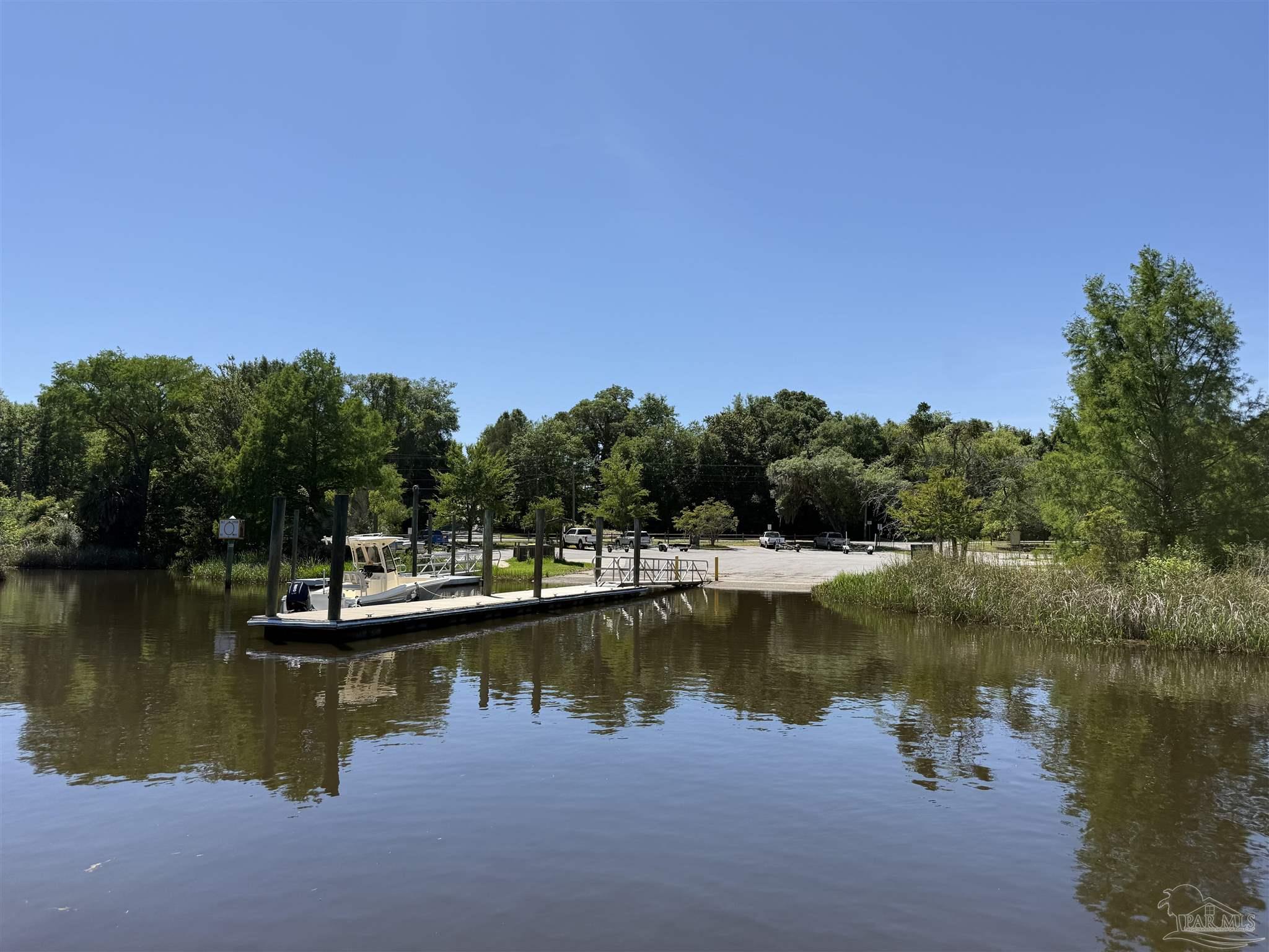 0 Broad Street Milton, FL 32570 - Photo 28 of 28 a view of a lake with houses in the back