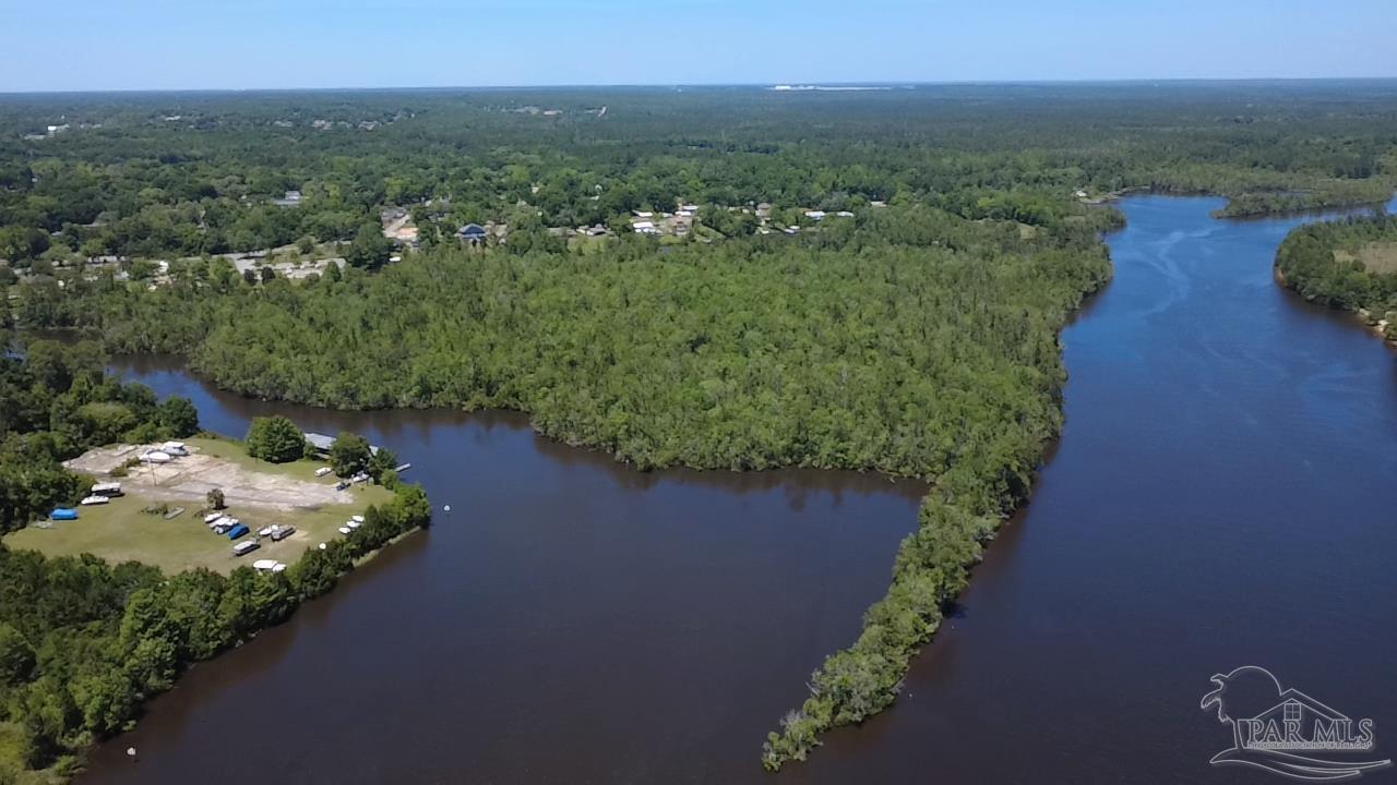 0 Broad Street Milton, FL 32570 - Photo 8 of 28 an aerial view of a house with yard