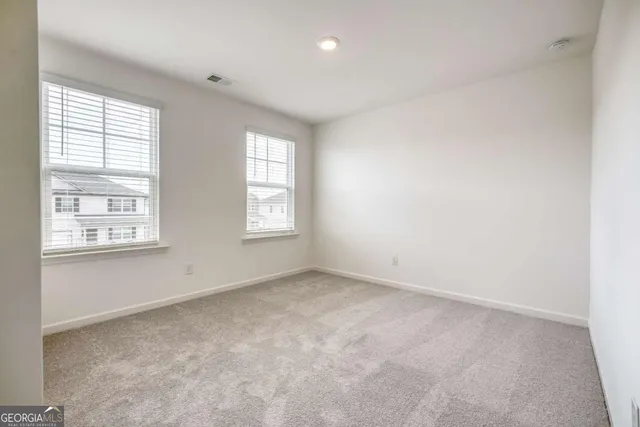 an empty room with windows