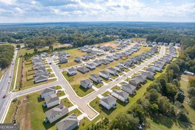 an aerial view of residential building with parking space