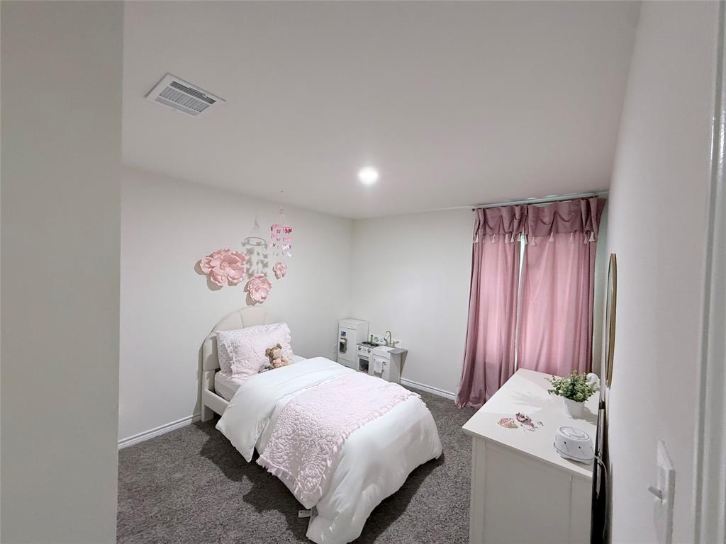 1602 Maple Ridge Drive Princeton, TX 75407 - Photo 6 of 13 Recessed lighting, light gray wall paint, gray carpet flooring, and window treatments