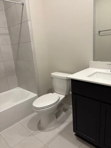 a bathroom with a bathtub and a sink