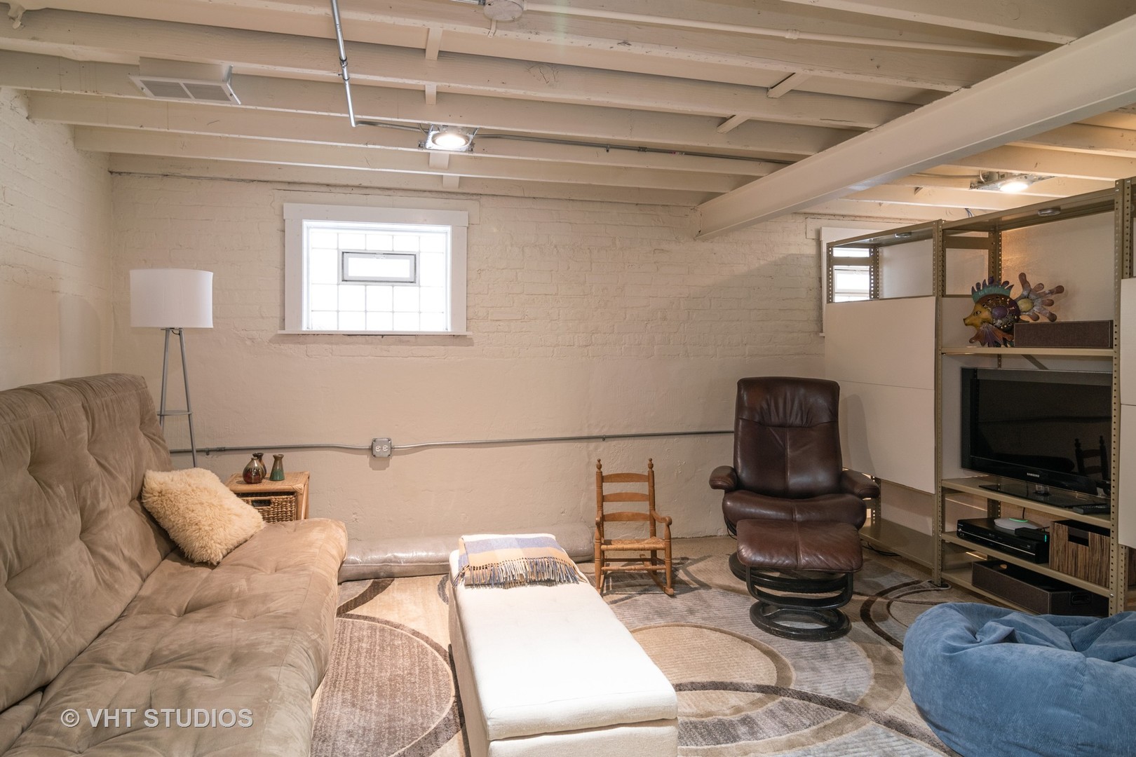 539 Selborne Road Riverside, IL 60546 - Photo 15 of 17 a living room with furniture a flat screen tv and gym equipment