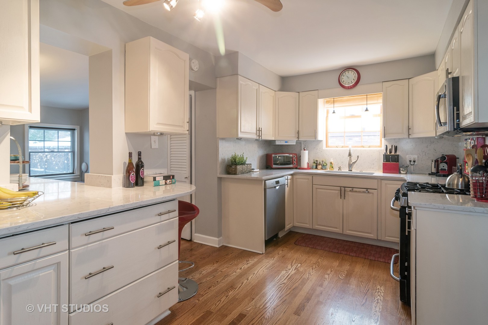 539 Selborne Road Riverside, IL 60546 - Photo 5 of 17 a kitchen with a sink cabinets stainless steel appliances and windows