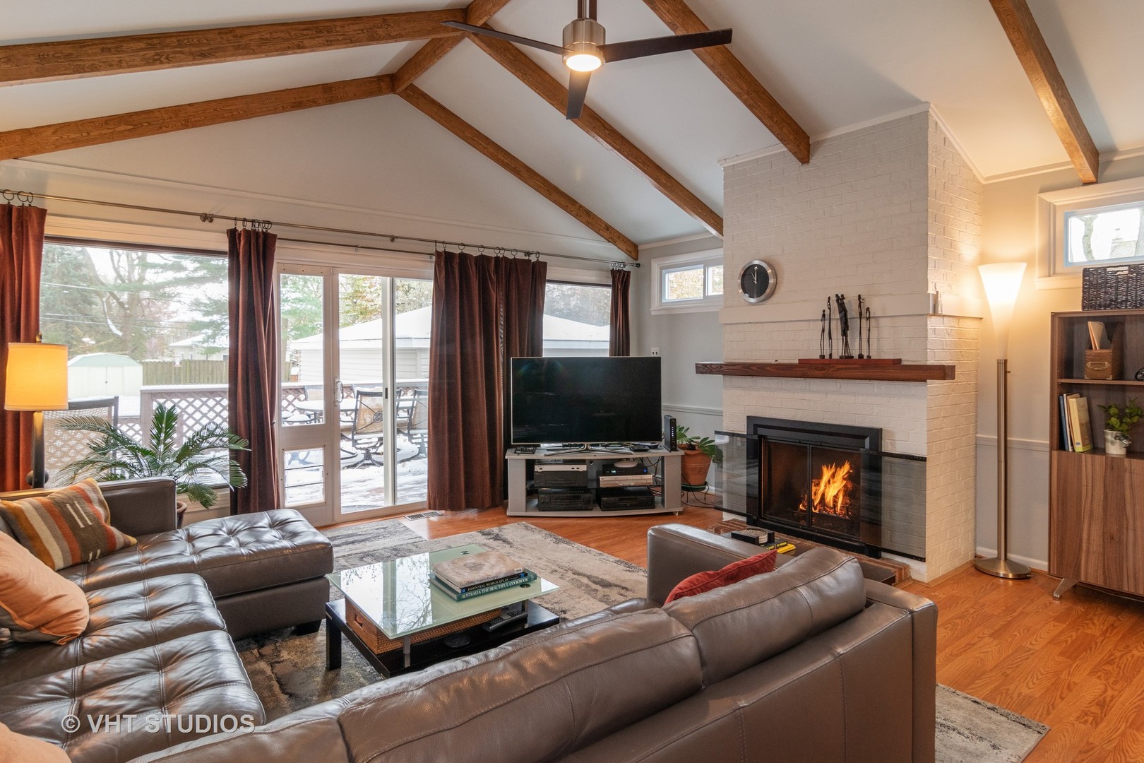 539 Selborne Road Riverside, IL 60546 - Photo 9 of 17 a living room with furniture flat screen tv and a fireplace