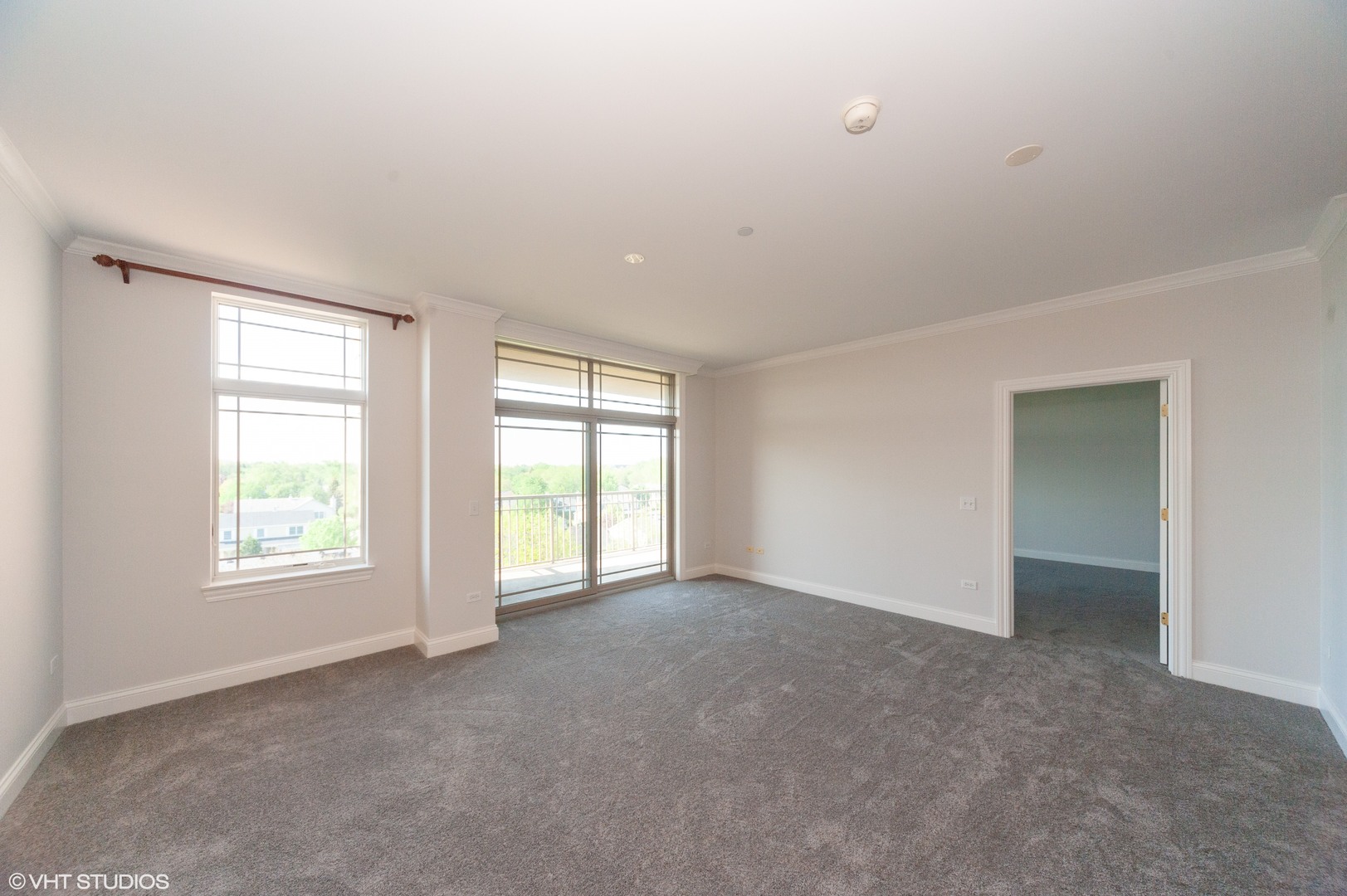 115 Prairie Park Drive, Unit 407 Wheeling, IL 60090 - Photo 7 of 17 an empty room with windows