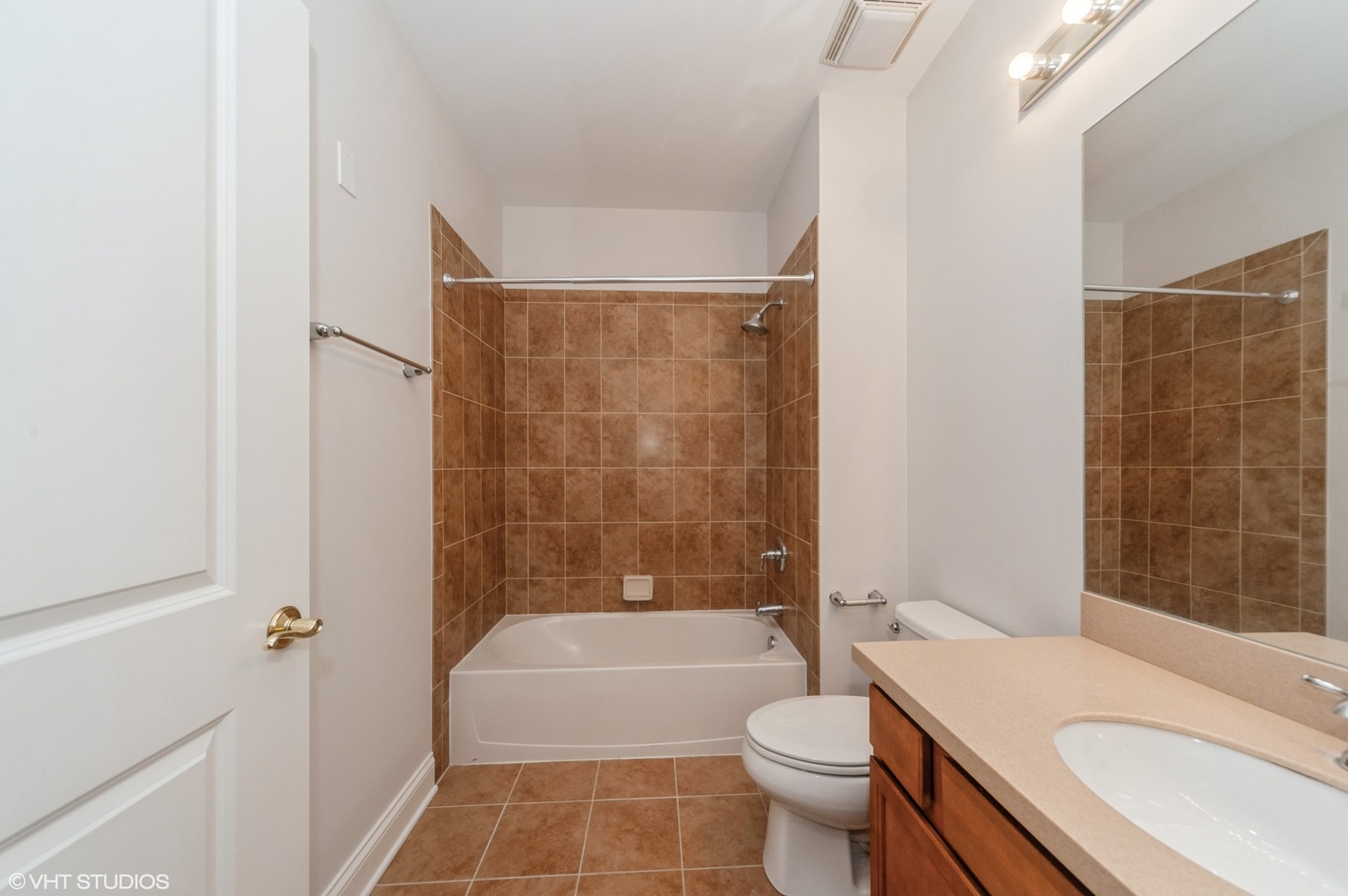 115 Prairie Park Drive, Unit 407 Wheeling, IL 60090 - Photo 9 of 17 a bathroom with a sink a toilet and shower