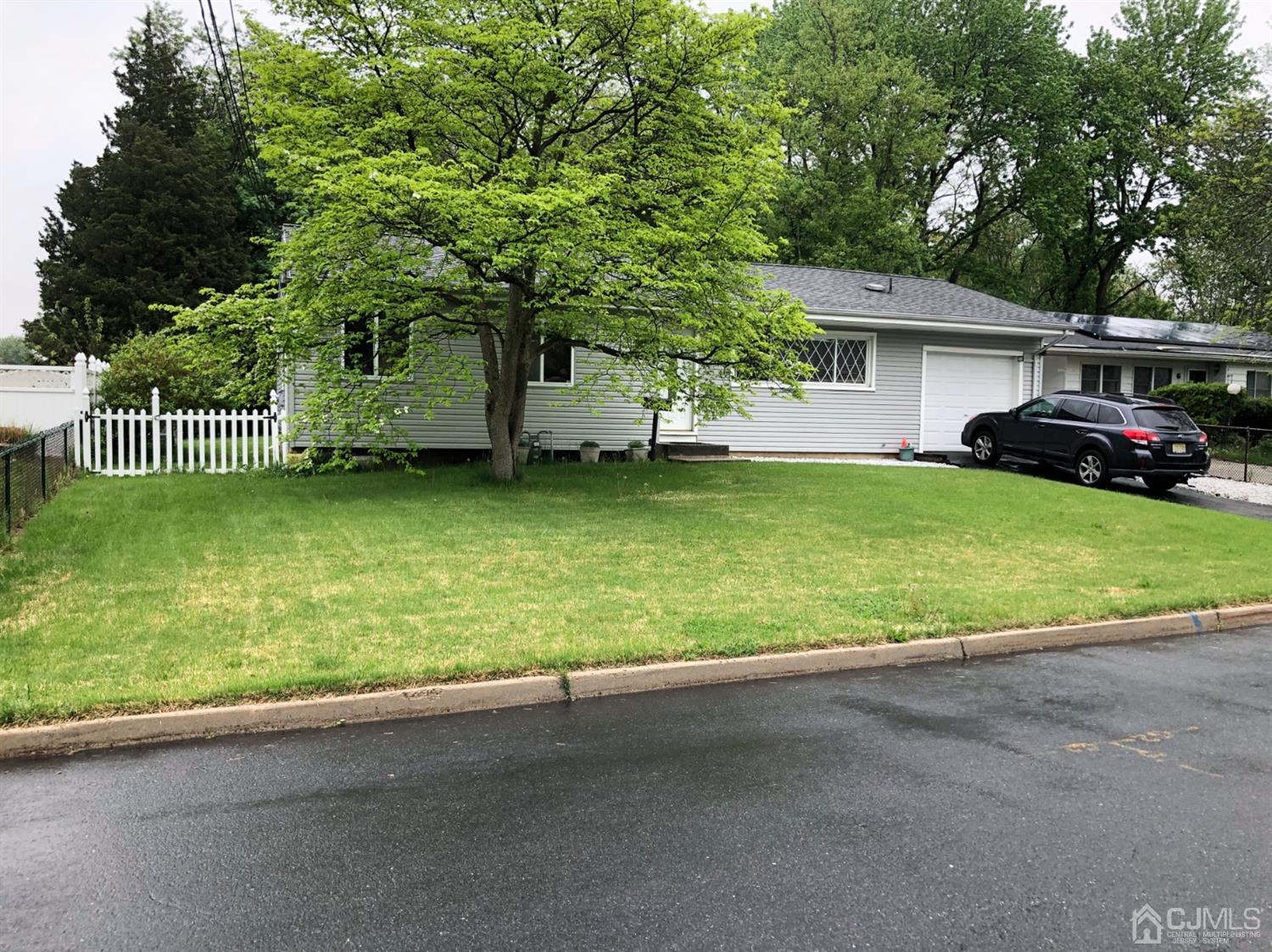 4 Brandeis Road Old Bridge, NJ 08859 - Photo 1 of 24 a view of a house with backyard and a tree