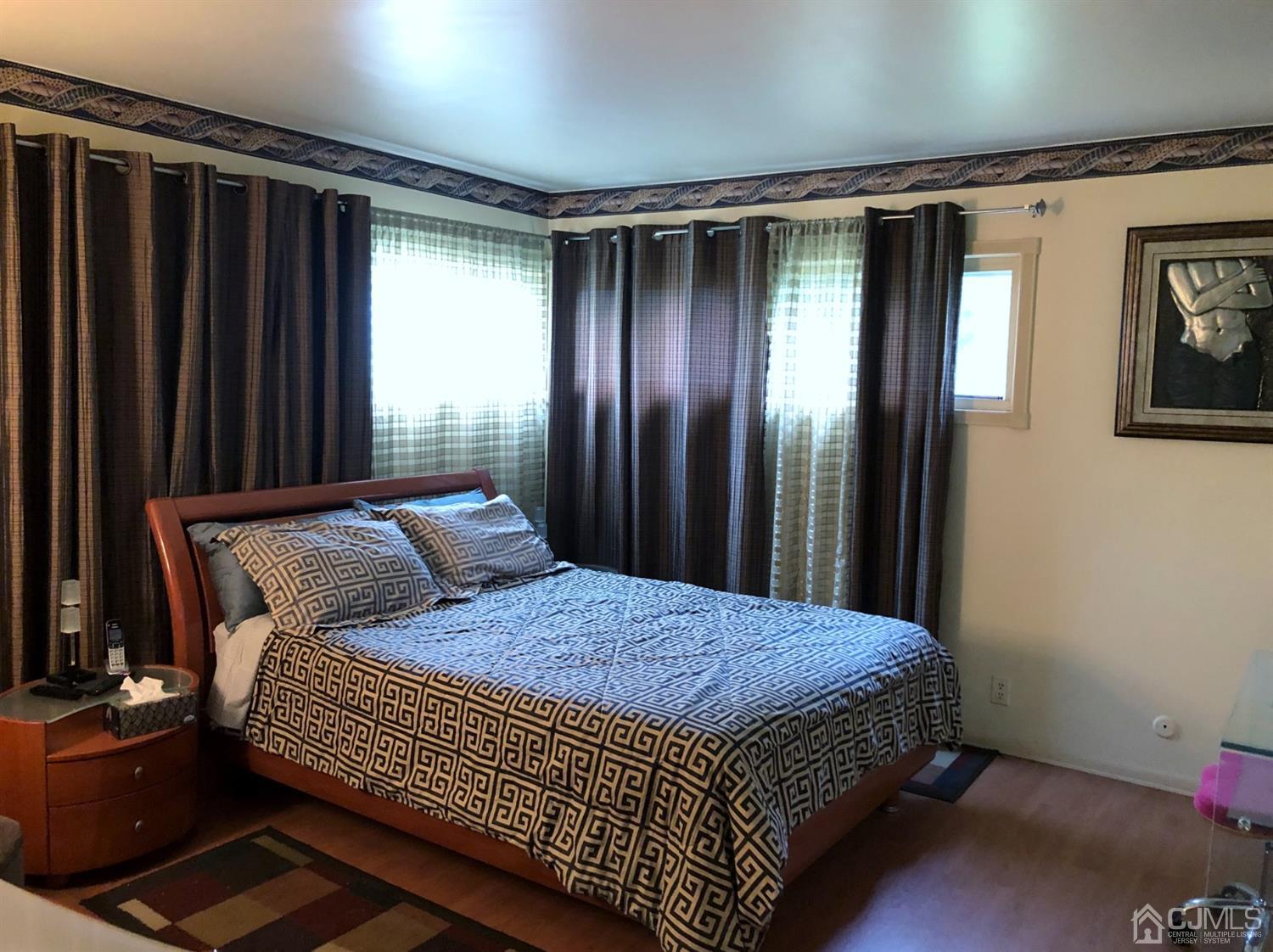 4 Brandeis Road Old Bridge, NJ 08859 - Photo 11 of 24 a bedroom with a bed and a window