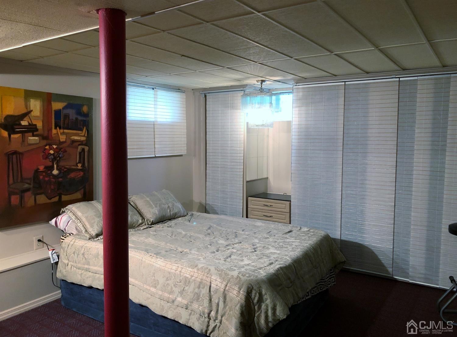 4 Brandeis Road Old Bridge, NJ 08859 - Photo 20 of 24 a bedroom with a bed and wooden floor