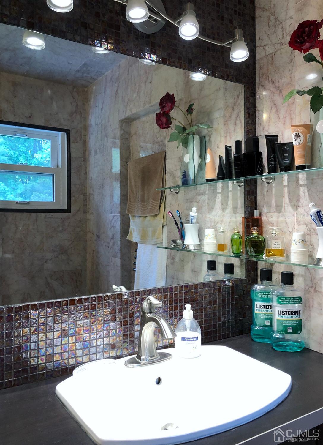 4 Brandeis Road Old Bridge, NJ 08859 - Photo 8 of 24 a bathroom with a sink and a mirror